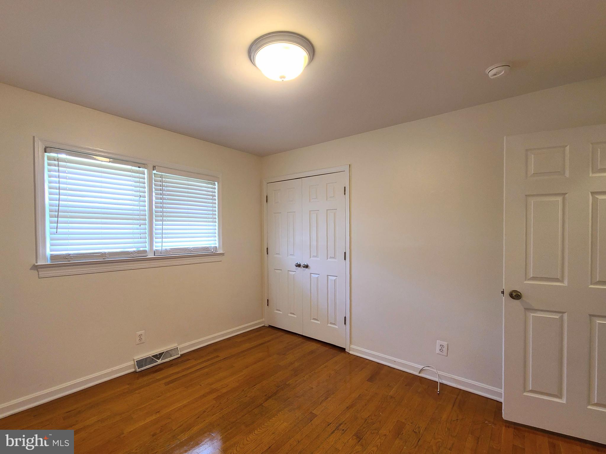 204 Mt Pleasant Boulevard Fredericksburg, VA 22405 - Photo 12 of 30 a view of an empty room with wooden floor and a window