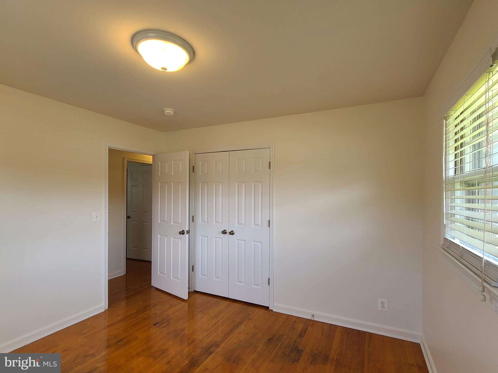 204 Mt Pleasant Boulevard Fredericksburg, VA 22405 - Photo 13 of 30 an empty room with wooden floor and windows