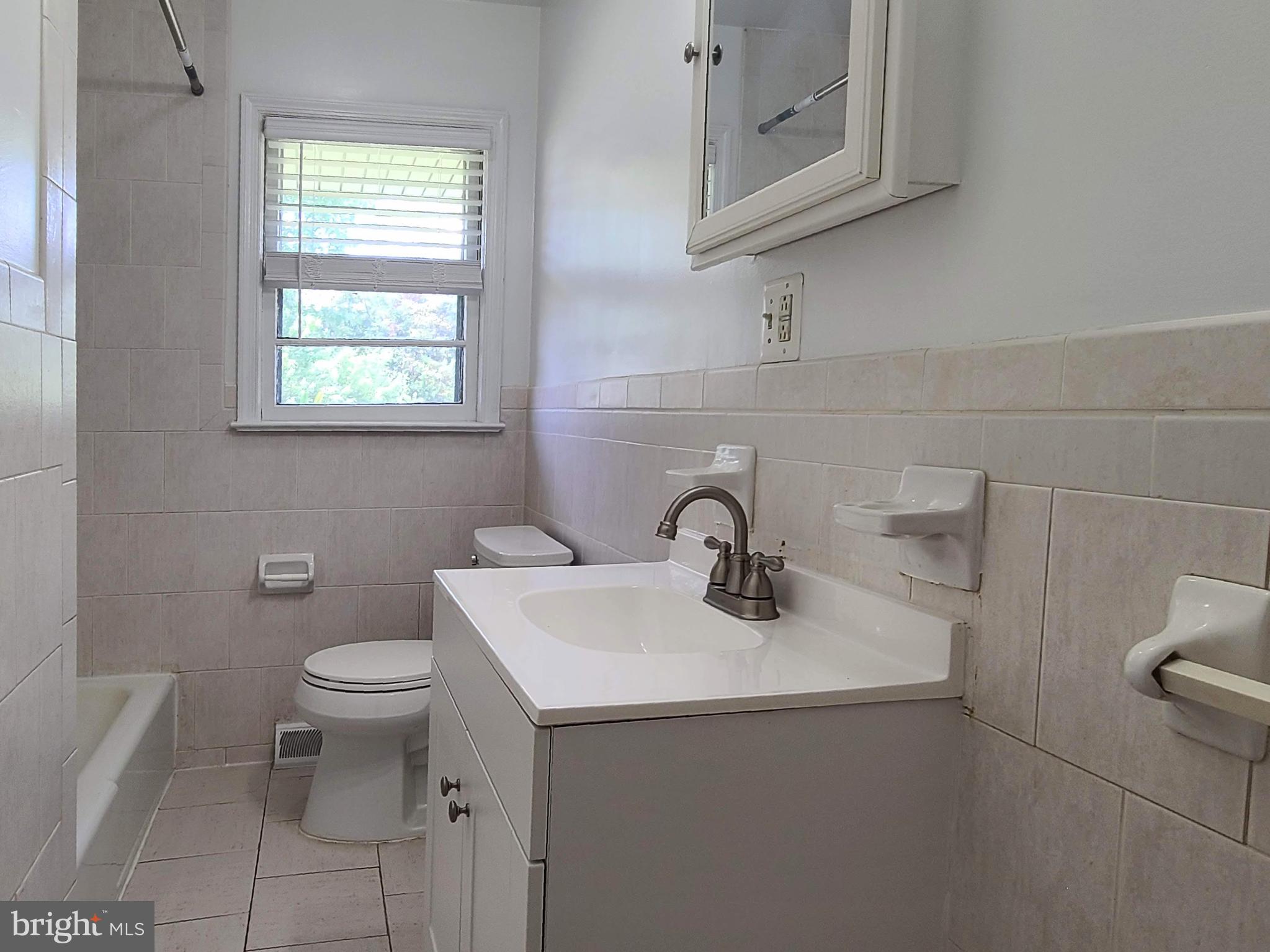 204 Mt Pleasant Boulevard Fredericksburg, VA 22405 - Photo 15 of 30 a bathroom with a toilet sink and mirror