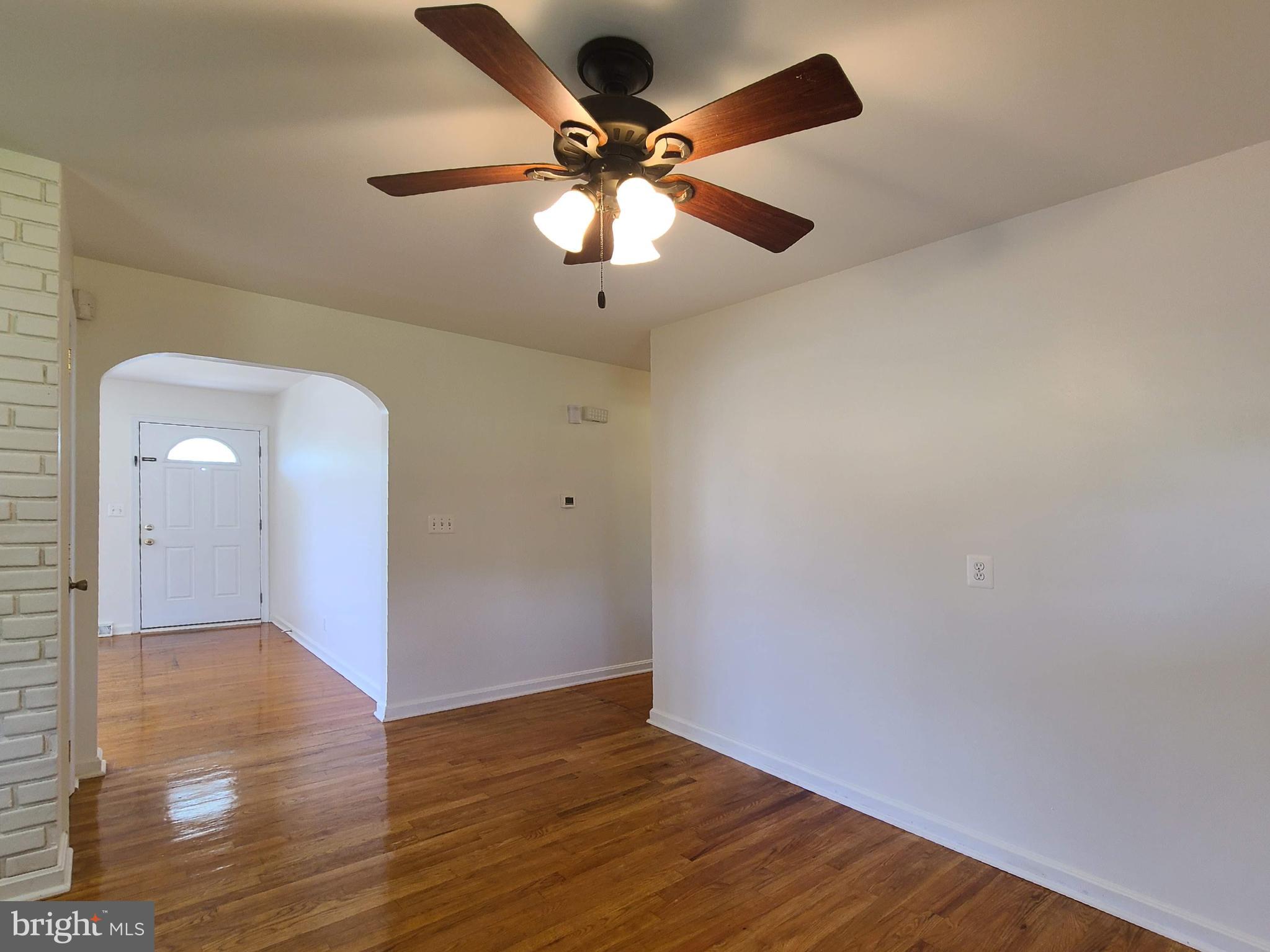 204 Mt Pleasant Boulevard Fredericksburg, VA 22405 - Photo 4 of 30 wooden floor in an empty room with a window