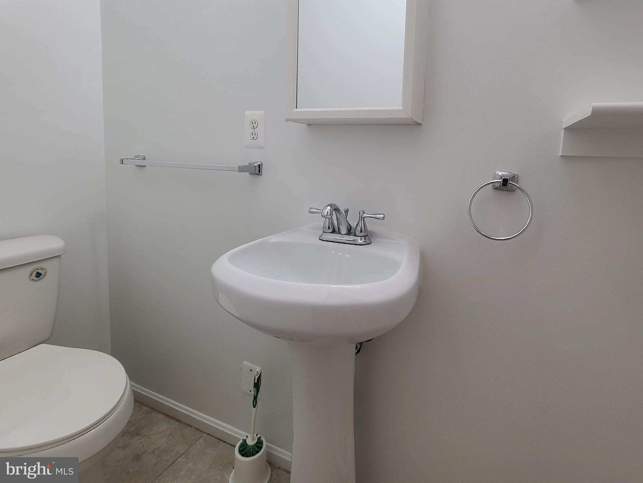 204 Mt Pleasant Boulevard Fredericksburg, VA 22405 - Photo 10 of 30 a bathroom with a sink toilet and a mirror