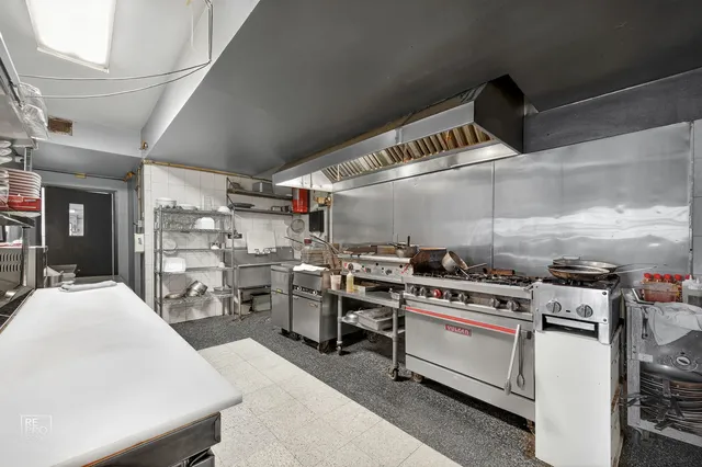 a kitchen with a stove and cabinets