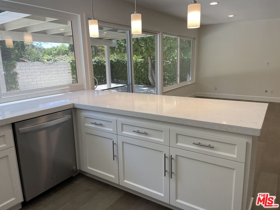 22634 Town Crier Road Calabasas, CA 91302 - Photo 2 of 7 a kitchen with a sink and large window