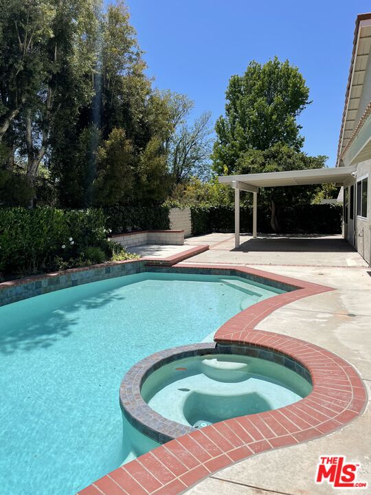 22634 Town Crier Road Calabasas, CA 91302 - Photo 7 of 7 a view of a backyard with plants and patio