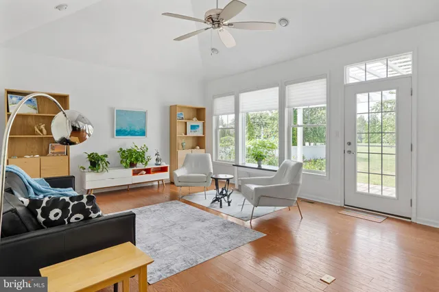 a kitchen with granite countertop white cabinets and stainless steel appliances