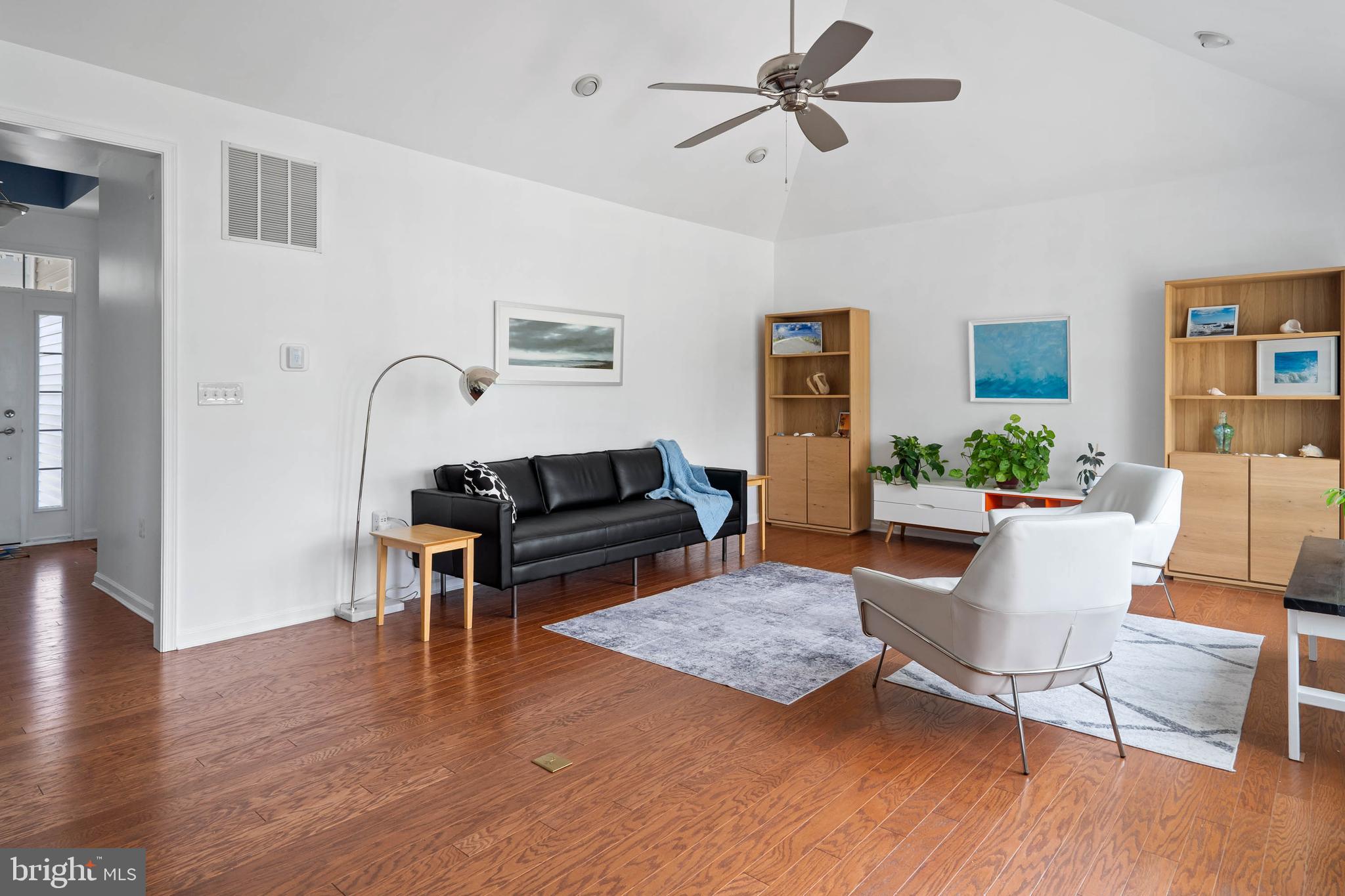 18923 Roth Drive Lewes, DE 19958 - Photo 17 of 73 a living room with furniture and a wooden floor