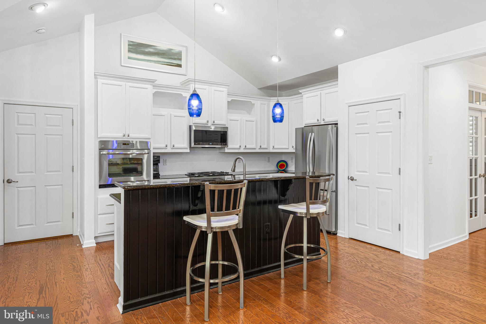 18923 Roth Drive Lewes, DE 19958 - Photo 22 of 73 a kitchen with stainless steel appliances a refrigerator and microwave