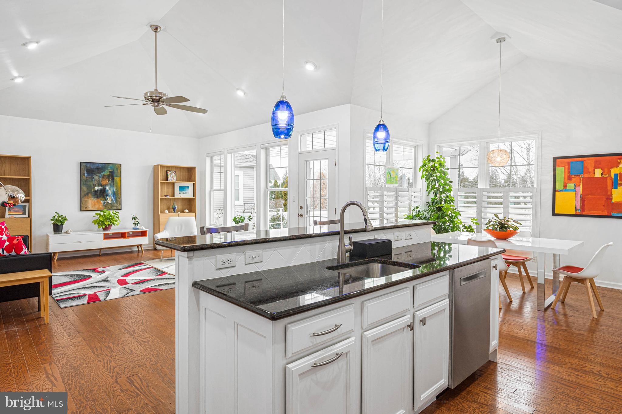 18923 Roth Drive Lewes, DE 19958 - Photo 26 of 73 a kitchen with a sink stove and wooden floor