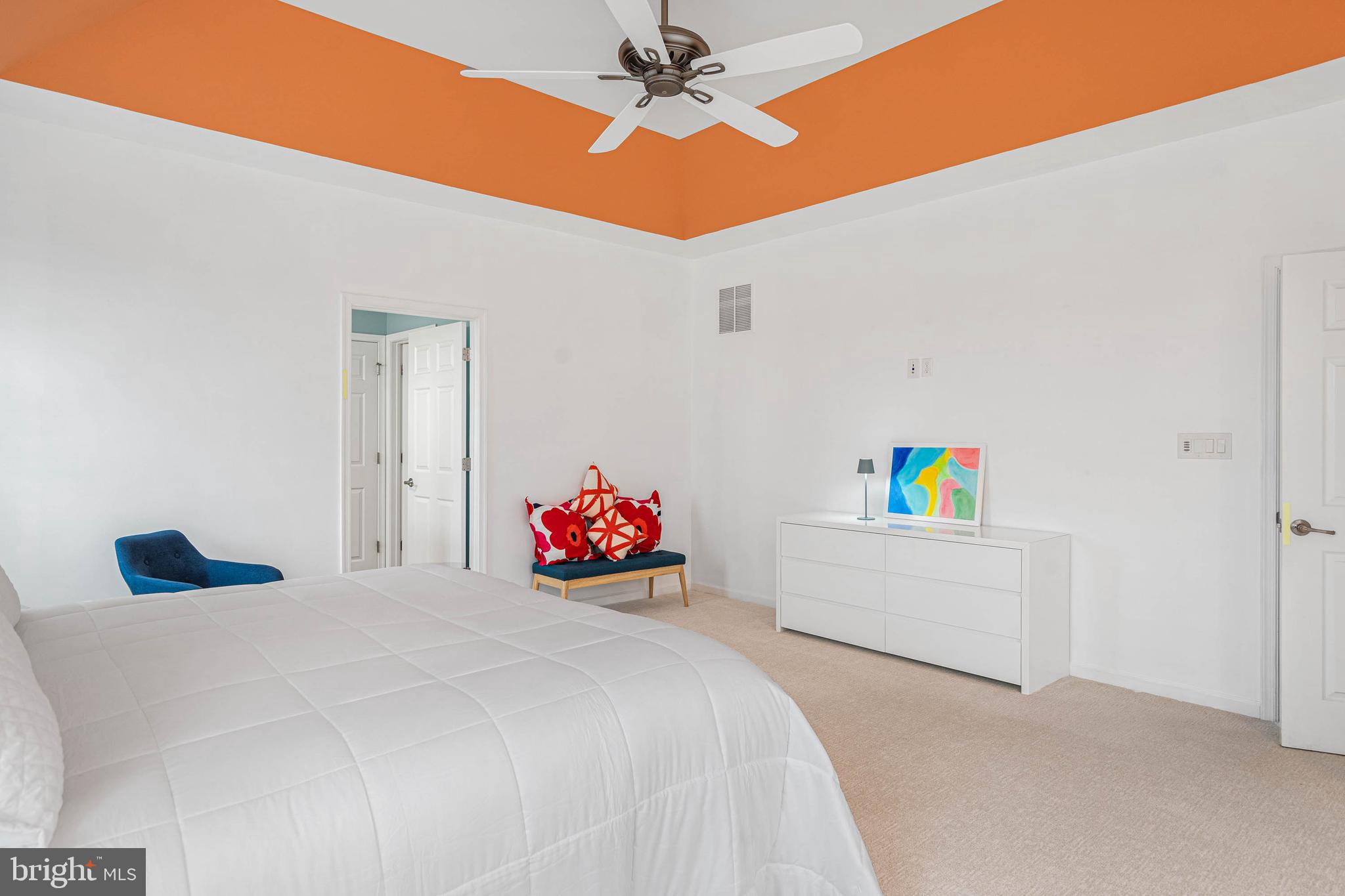 18923 Roth Drive Lewes, DE 19958 - Photo 29 of 73 a bedroom with a bed and a chandelier