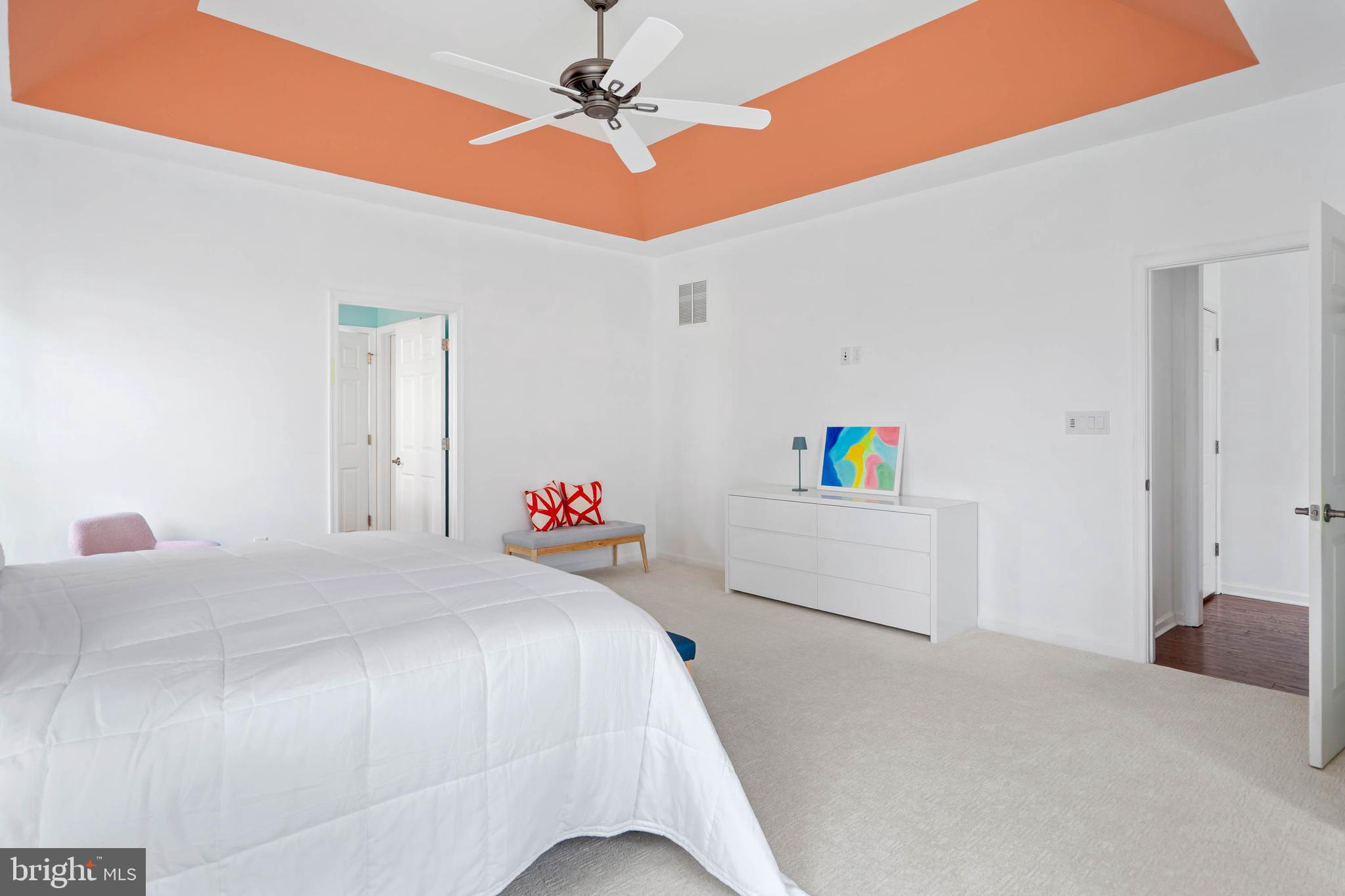 18923 Roth Drive Lewes, DE 19958 - Photo 30 of 73 a bedroom with a bed and a chandelier