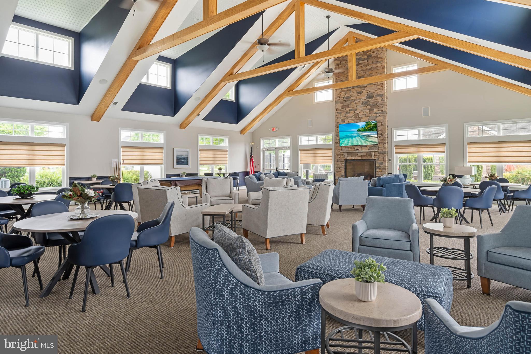 18923 Roth Drive Lewes, DE 19958 - Photo 44 of 73 a living room with lots of furniture and a chandelier