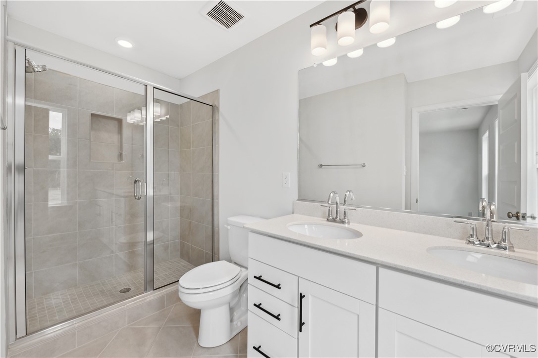 331 Mt Mccauley Way Aylett, VA 23009 - Photo 14 of 48 a bathroom with a sink a toilet and shower