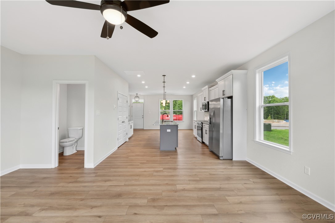 331 Mt Mccauley Way Aylett, VA 23009 - Photo 3 of 48 a view of a hallway with wooden floor and windows