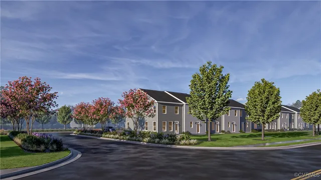 a view of a green field in front of a house