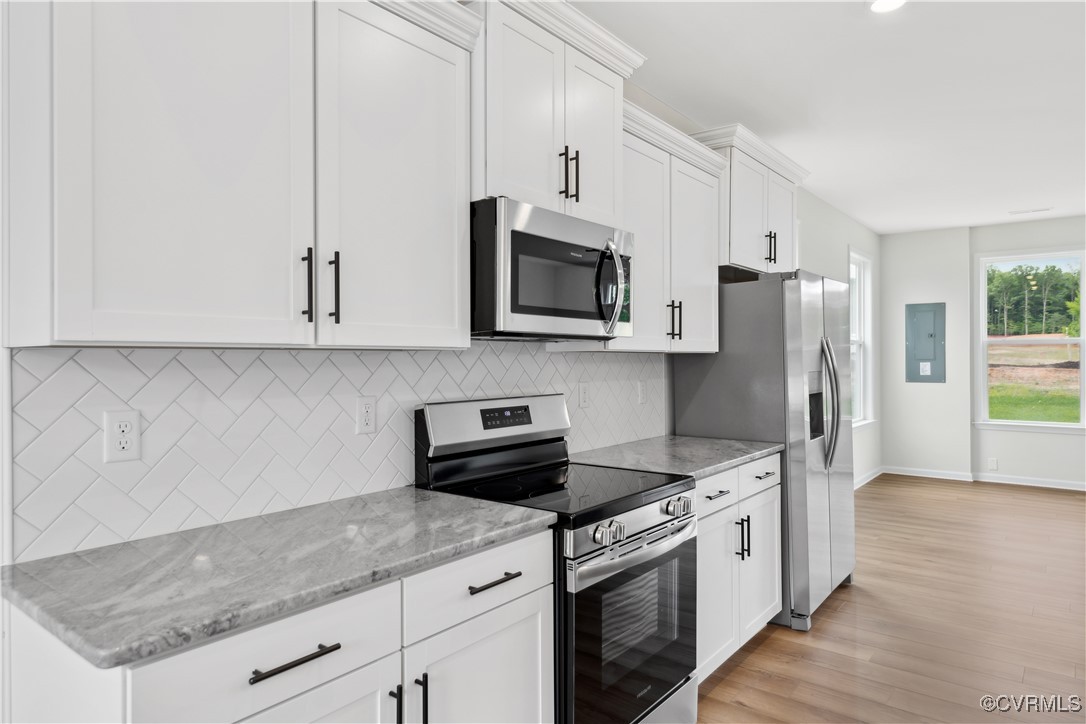 331 Mt Mccauley Way Aylett, VA 23009 - Photo 4 of 48 a kitchen with stainless steel appliances granite countertop a stove a refrigerator and a microwave