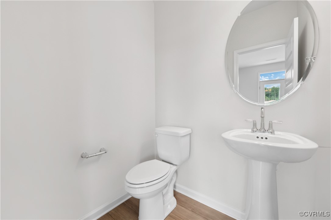 331 Mt Mccauley Way Aylett, VA 23009 - Photo 7 of 48 a bathroom with a toilet a sink and mirror