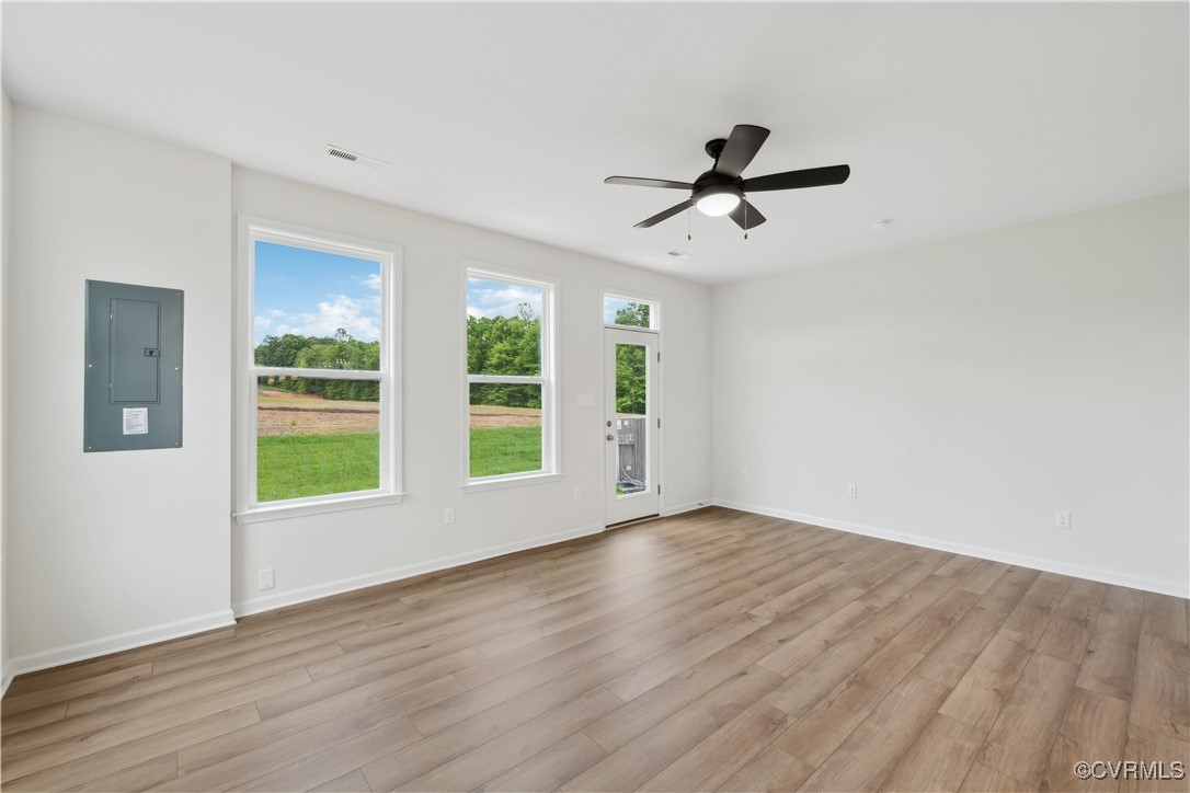 331 Mt Mccauley Way Aylett, VA 23009 - Photo 10 of 48 a view of an empty room with a window and wooden floor