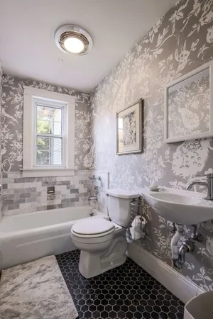 a bathroom with a sink toilet and bathtub