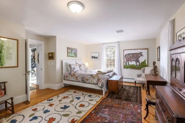 a living room with furniture and a rug