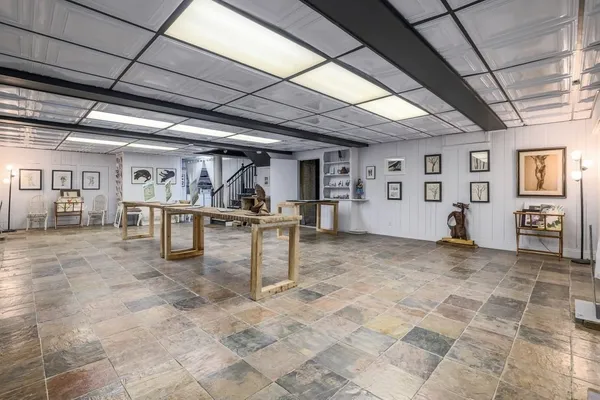 a view of a hall with wooden floors