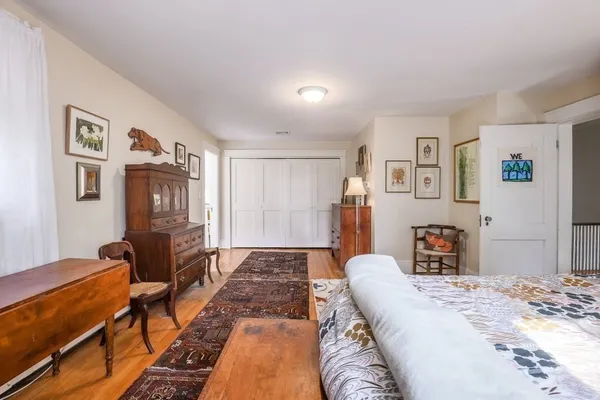 a bed room with a bed and dresser