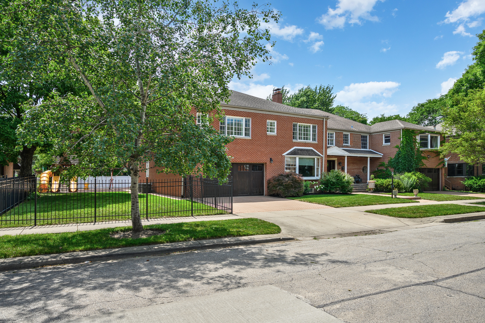 2851 West Rascher Avenue Chicago, IL 60625 - Photo 2 of 98 a front view of a house with a yard and trees