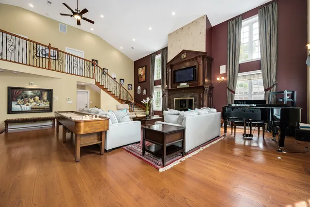 a view of a livingroom with a fireplace and a workspace