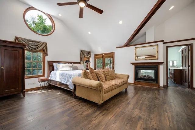 an aerial view of a house with swimming pool and sitting area