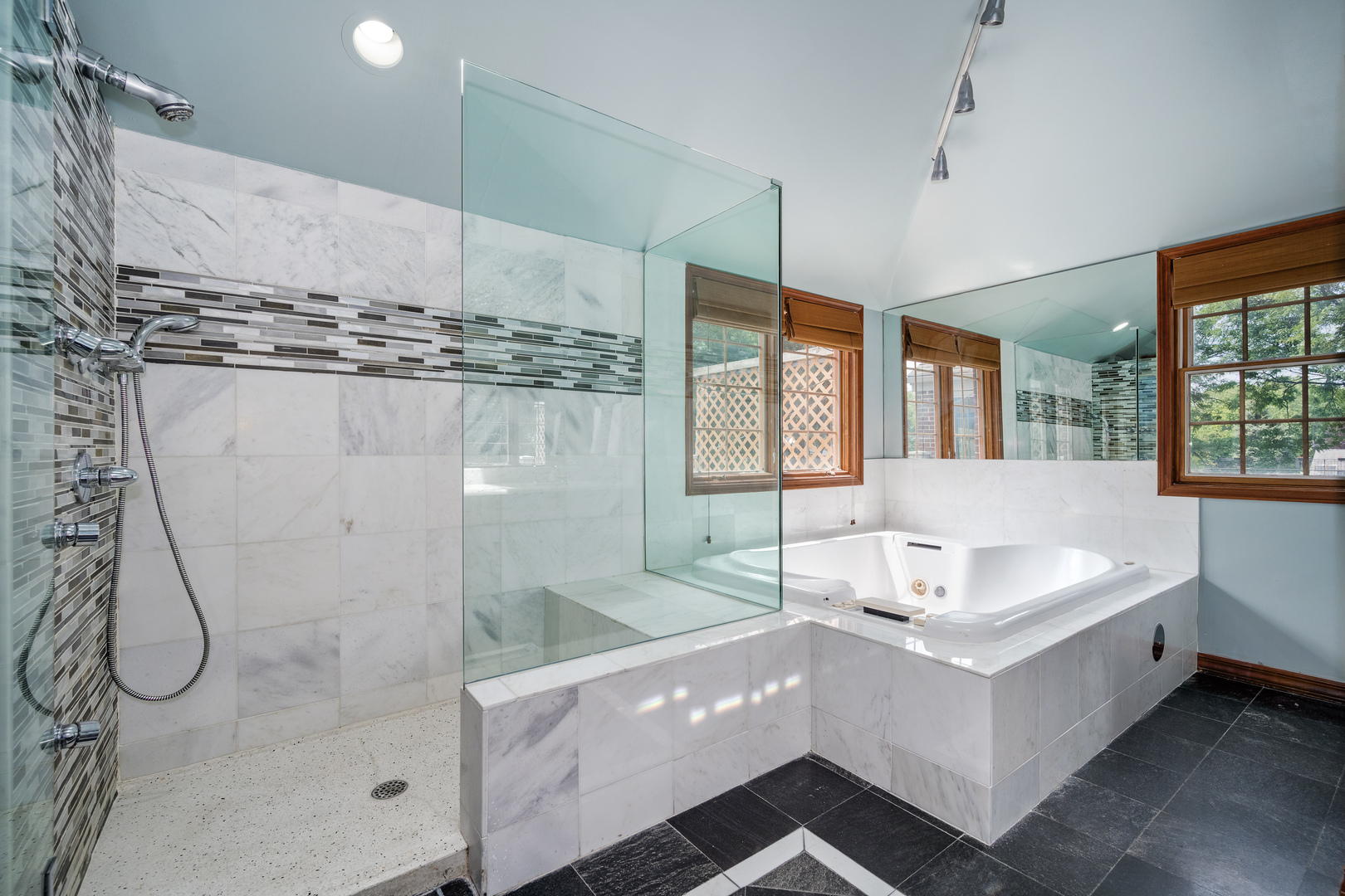 2851 West Rascher Avenue Chicago, IL 60625 - Photo 48 of 98 a spacious bathroom with a tub sink and mirror