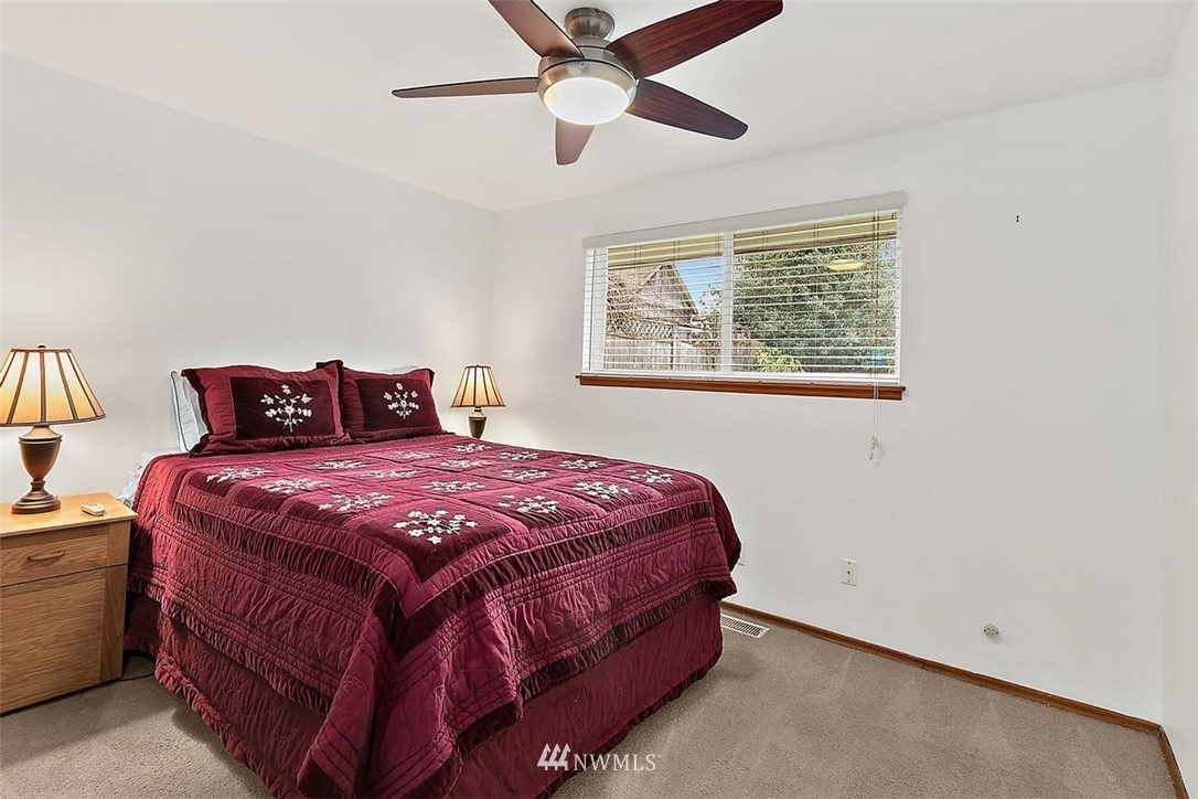 3407 Northeast 11th Street Renton, WA 98056 - Photo 13 of 27 a bedroom with a bed and window