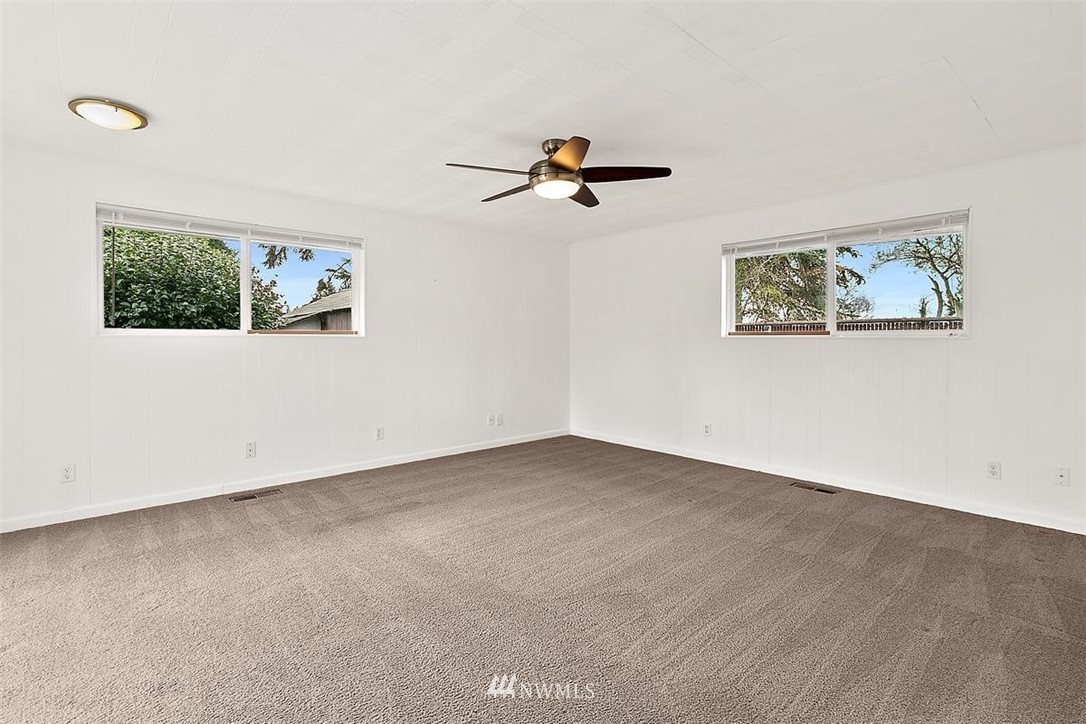 3407 Northeast 11th Street Renton, WA 98056 - Photo 18 of 27 an empty room with a painting on the wall