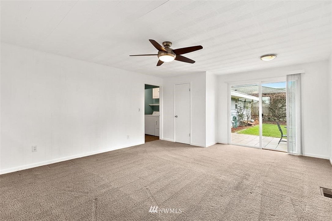 3407 Northeast 11th Street Renton, WA 98056 - Photo 19 of 27 a view of an empty room with a ceiling fan