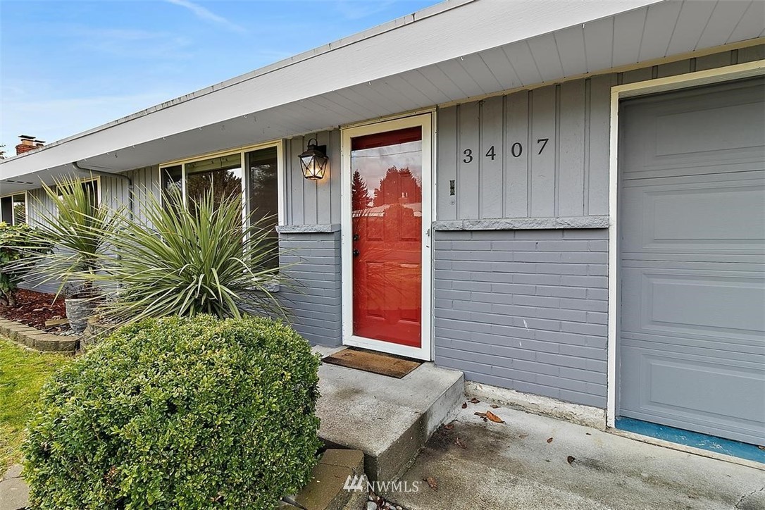 3407 Northeast 11th Street Renton, WA 98056 - Photo 2 of 27 a view of front door and potted plants