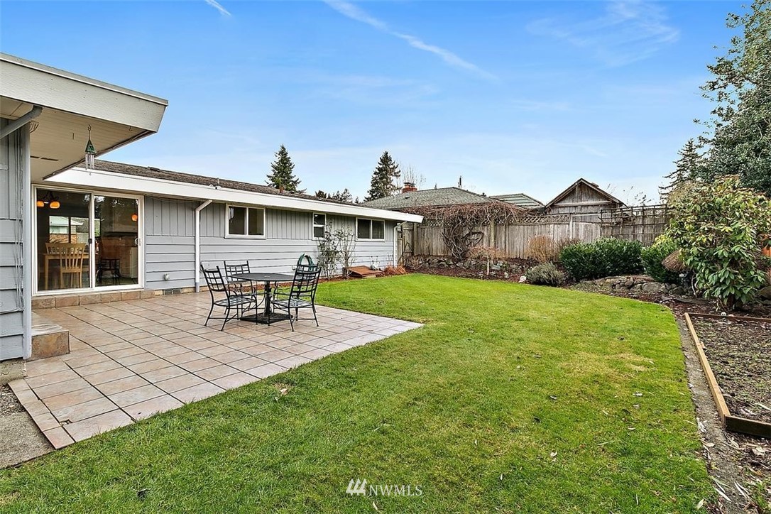 3407 Northeast 11th Street Renton, WA 98056 - Photo 21 of 27 a view of a house with backyard porch and sitting area