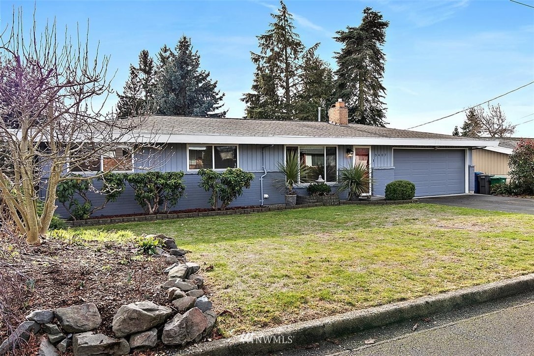 3407 Northeast 11th Street Renton, WA 98056 - Photo 27 of 27 a front view of a house with garden