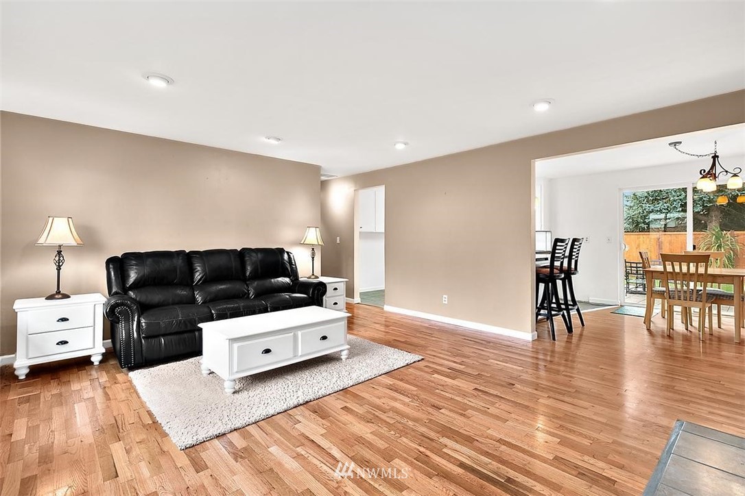 3407 Northeast 11th Street Renton, WA 98056 - Photo 3 of 27 a living room with furniture and a table