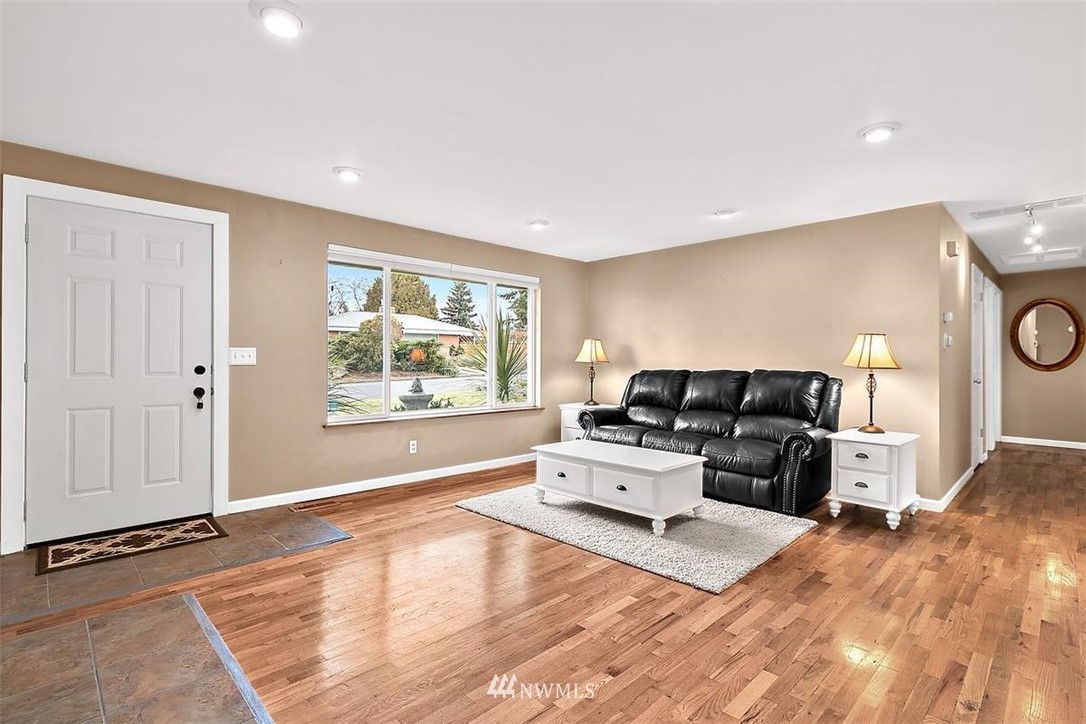 3407 Northeast 11th Street Renton, WA 98056 - Photo 4 of 27 a living room with furniture window and wooden floor