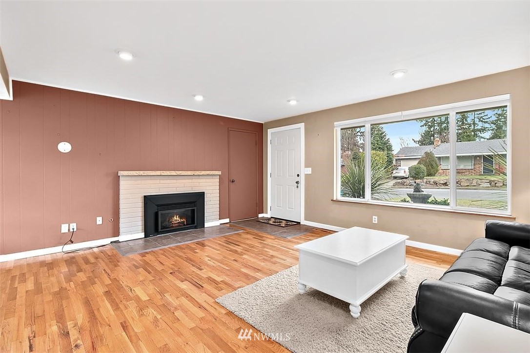 3407 Northeast 11th Street Renton, WA 98056 - Photo 5 of 27 a spacious bedroom with a large bed and a couch with garden view