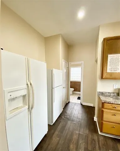 a kitchen with a refrigerator a sink and dishwasher