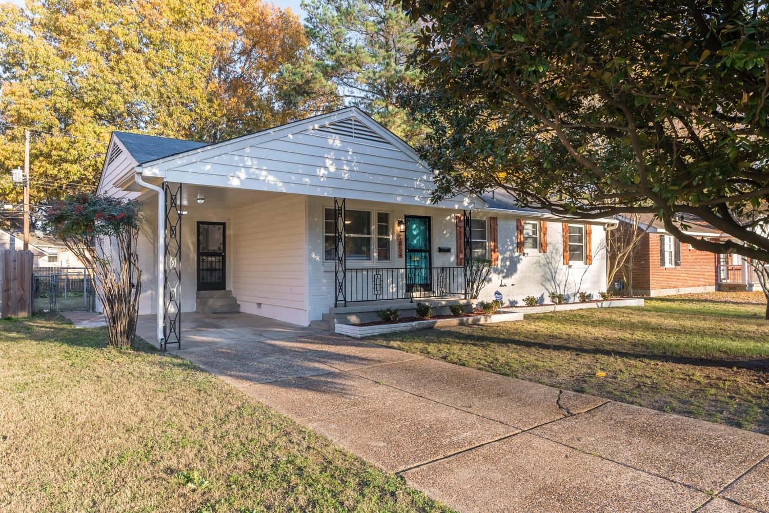 1854 Cherry Road Memphis, TN 38117 - Photo 2 of 25 a view of a house with a yard and large tree