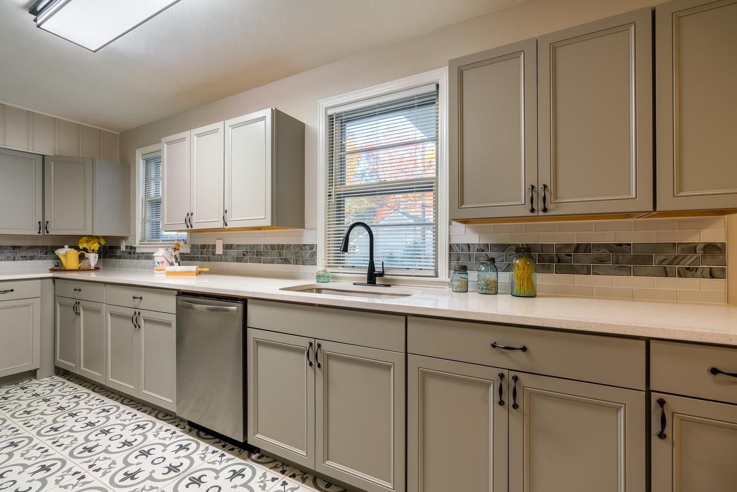 1854 Cherry Road Memphis, TN 38117 - Photo 11 of 25 a kitchen with stainless steel appliances granite countertop white cabinets sink and window