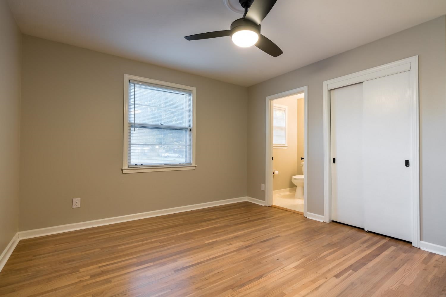 1854 Cherry Road Memphis, TN 38117 - Photo 13 of 25 wooden floor in an empty room with a window