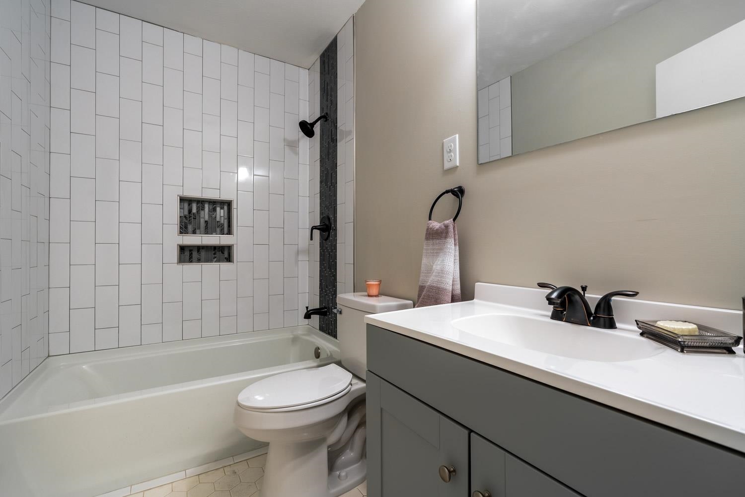 1854 Cherry Road Memphis, TN 38117 - Photo 17 of 25 a bathroom with a sink a toilet and shower