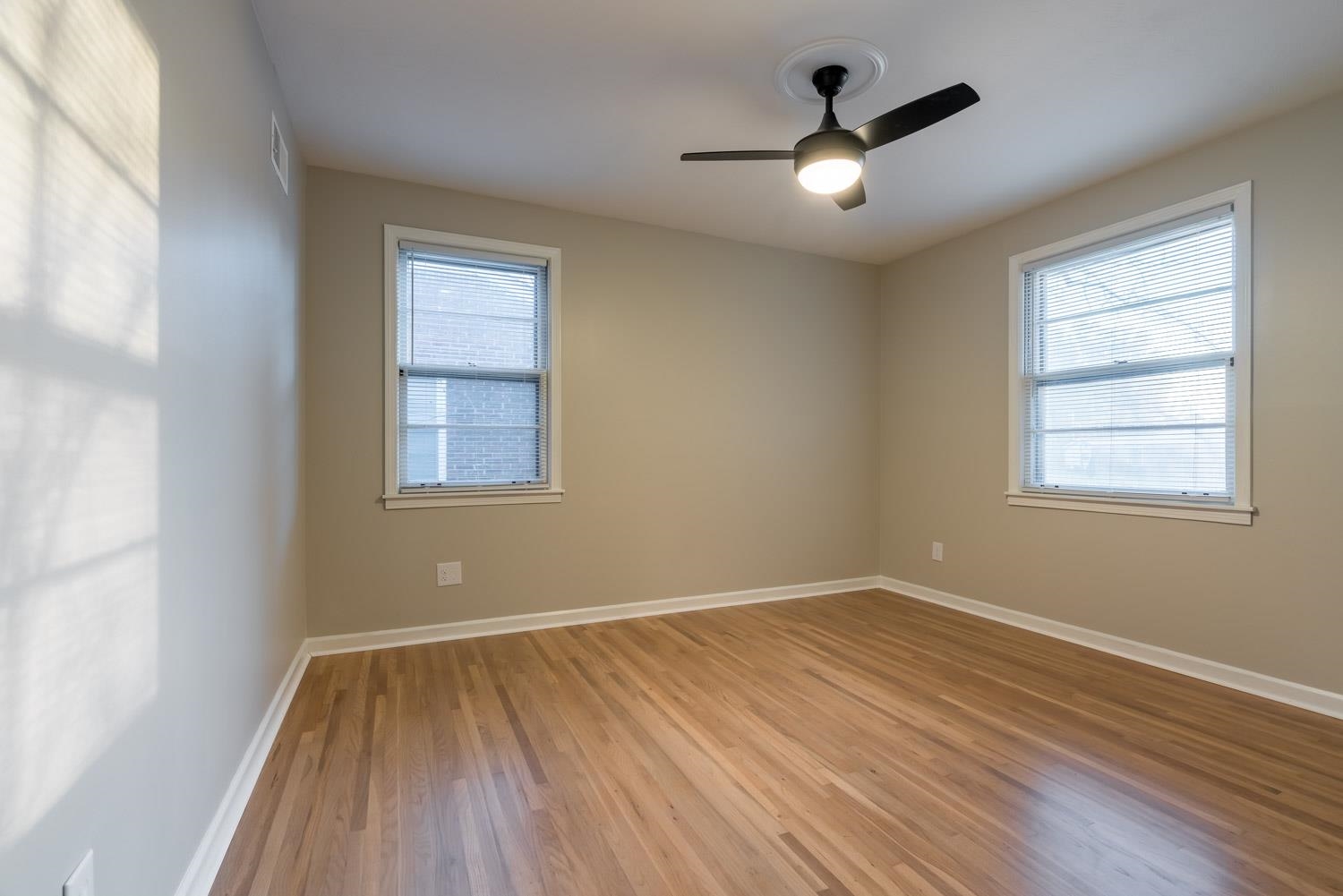 1854 Cherry Road Memphis, TN 38117 - Photo 19 of 25 a view of empty room with wooden floor and fan
