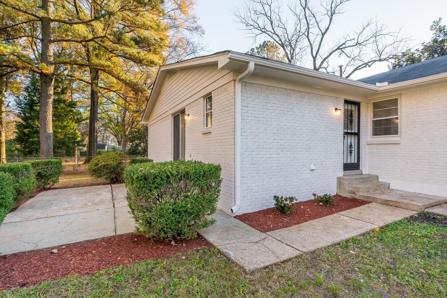 1854 Cherry Road Memphis, TN 38117 - Photo 23 of 25 a front view of a house with garden