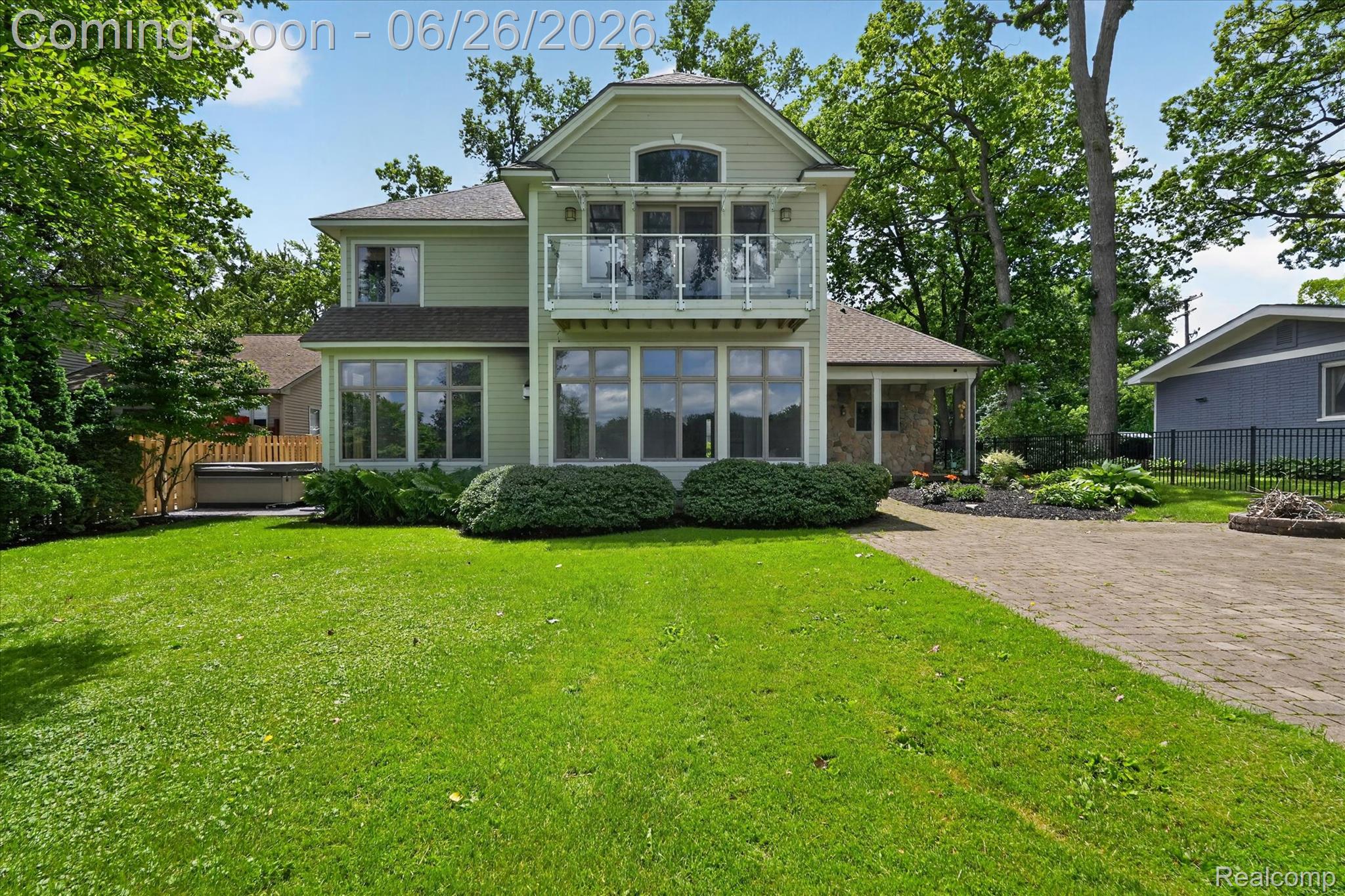 3478 Lexington Road Waterford, MI 48328 - Photo 3 of 52 Light green exterior with a second-story balcony featuring glass railings