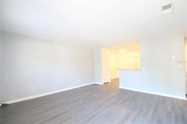 a view of kitchen with wooden floor