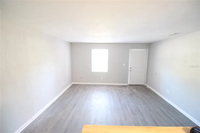 a kitchen with a sink cabinets and a window