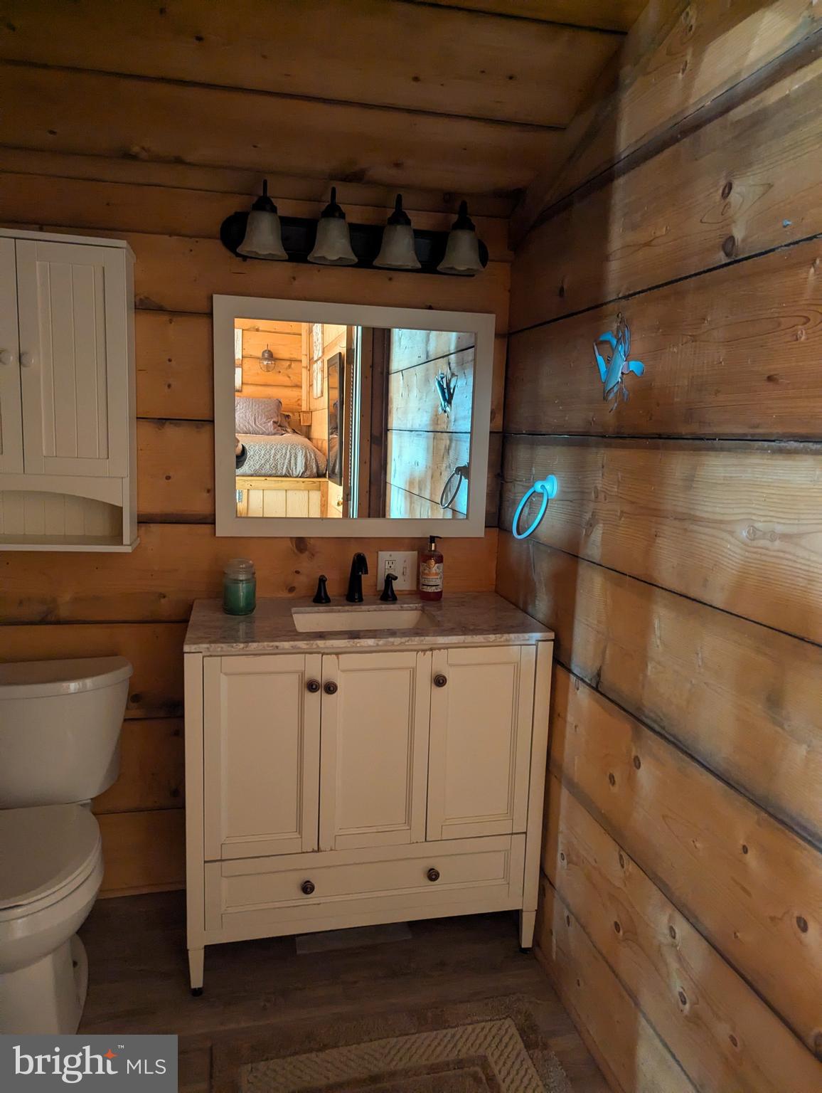 1 Detour Road Falling Waters, WV 25419 - Photo 25 of 36 a bathroom with a toilet sink and mirror