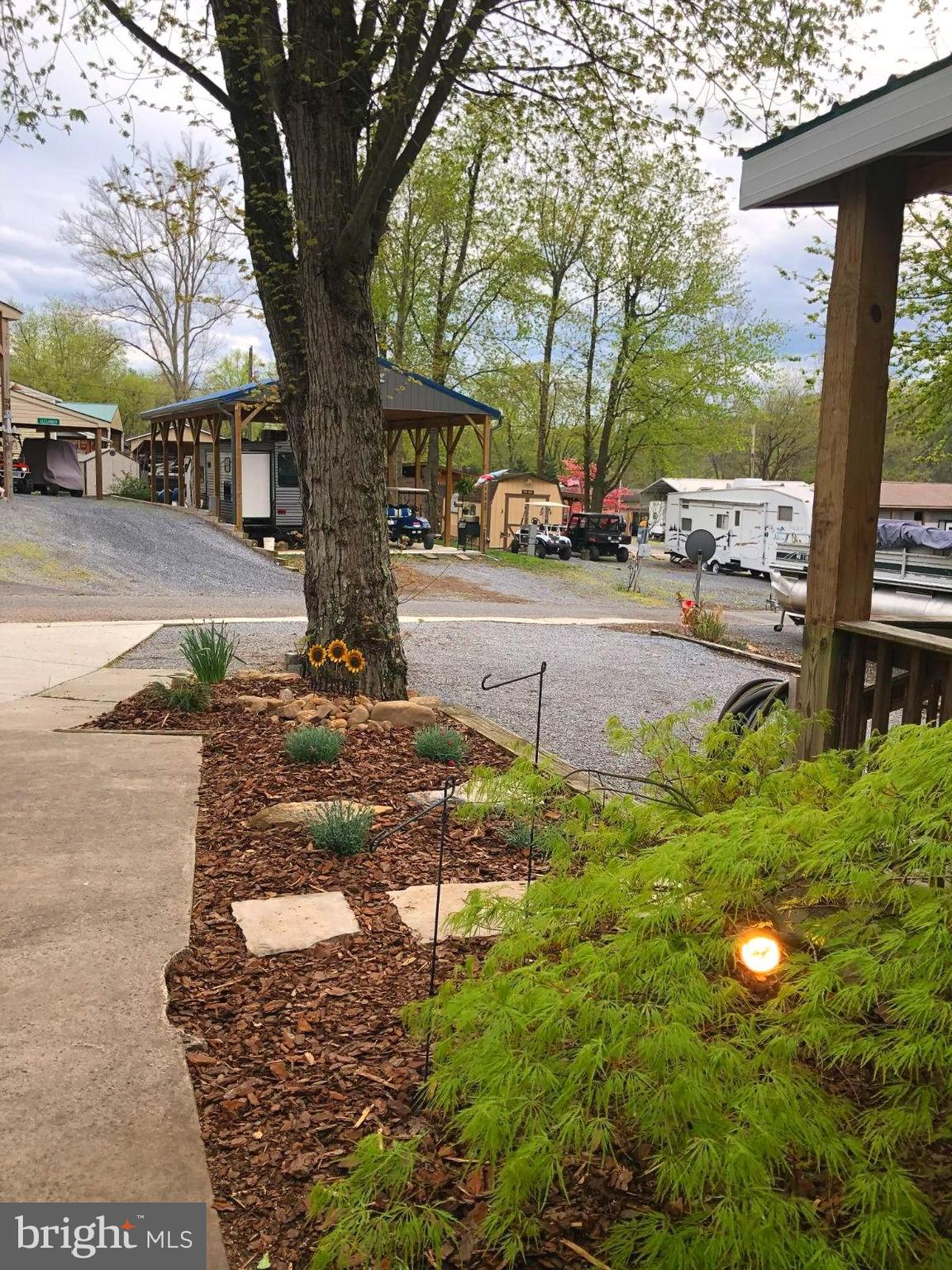 1 Detour Road Falling Waters, WV 25419 - Photo 5 of 36 a view of a yard with cars